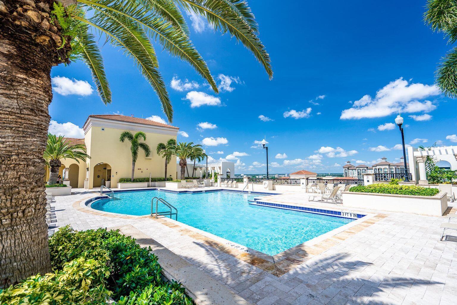 801 South Olive Avenue, Unit 435 West Palm Beach, FL 33401 - Photo 24 of 33 a view of a swimming pool with a patio