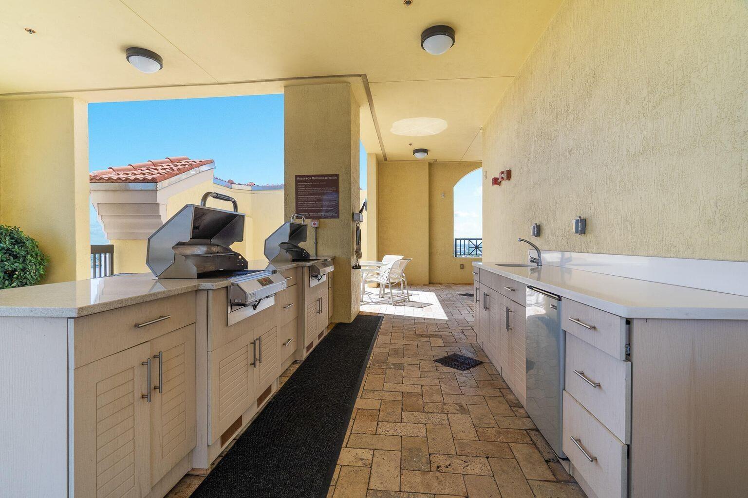 801 South Olive Avenue, Unit 435 West Palm Beach, FL 33401 - Photo 28 of 33 a large bathroom with a double vanity sink and a mirror