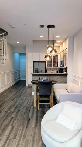 a kitchen with stainless steel appliances granite countertop a refrigerator and a sink