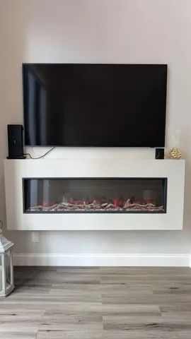 a living room with furniture and large windows