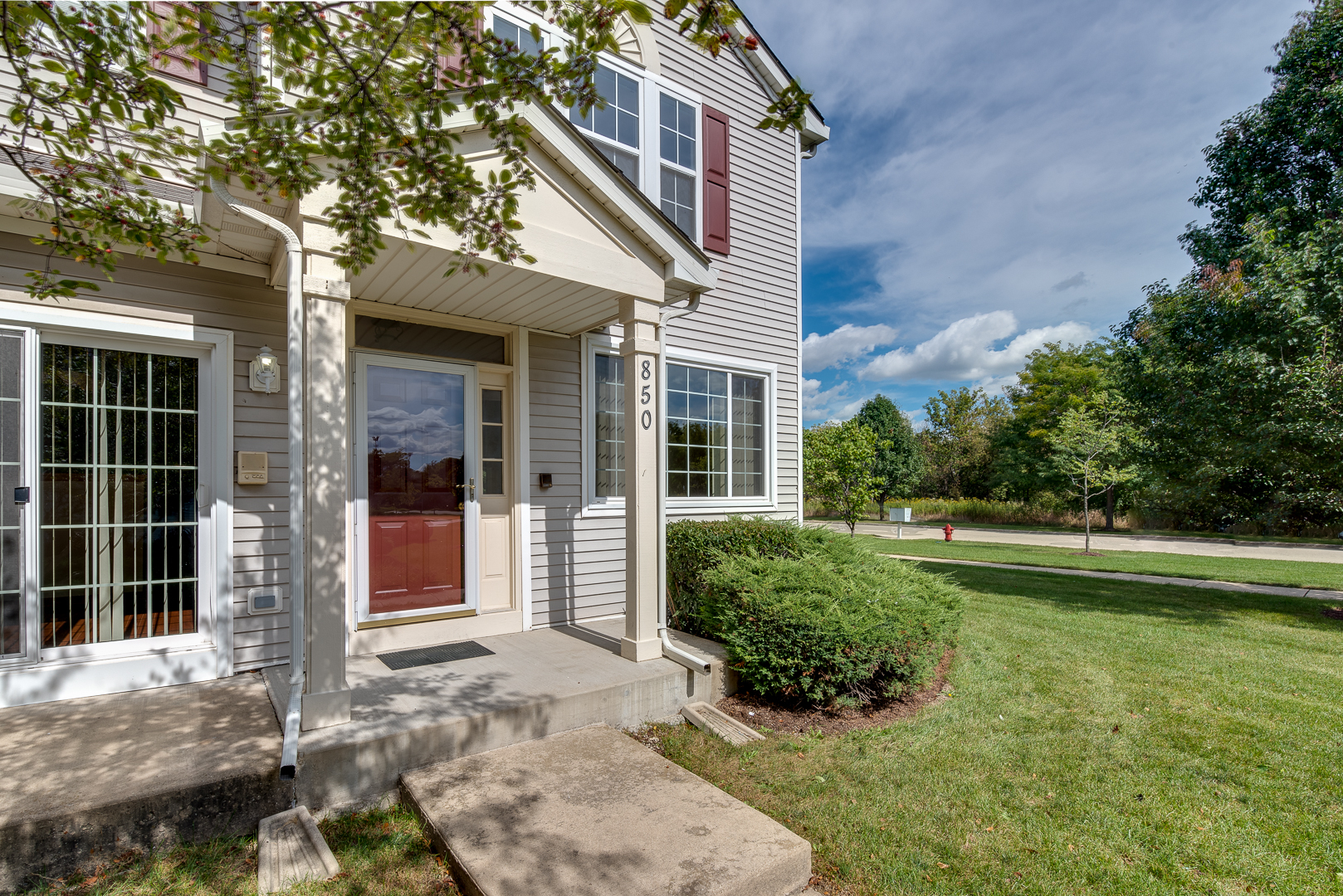850 County Line Road, Unit 850 Aurora, IL 60502 - Photo 2 of 20 a front view of a house with a yard