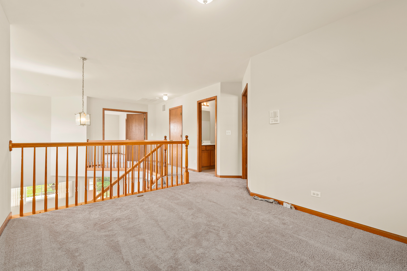 850 County Line Road, Unit 850 Aurora, IL 60502 - Photo 12 of 20 a view of a hallway with a window