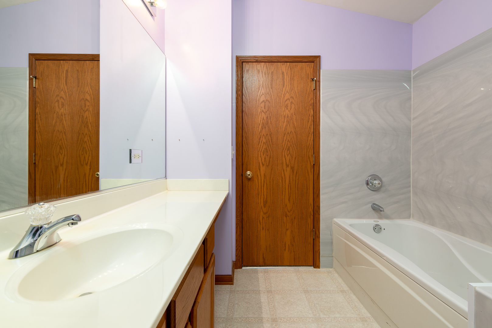 850 County Line Road, Unit 850 Aurora, IL 60502 - Photo 18 of 20 a bathroom with a tub sink and shower