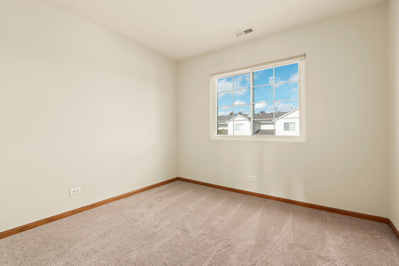 850 County Line Road, Unit 850 Aurora, IL 60502 - Photo 19 of 20 an empty room with a window