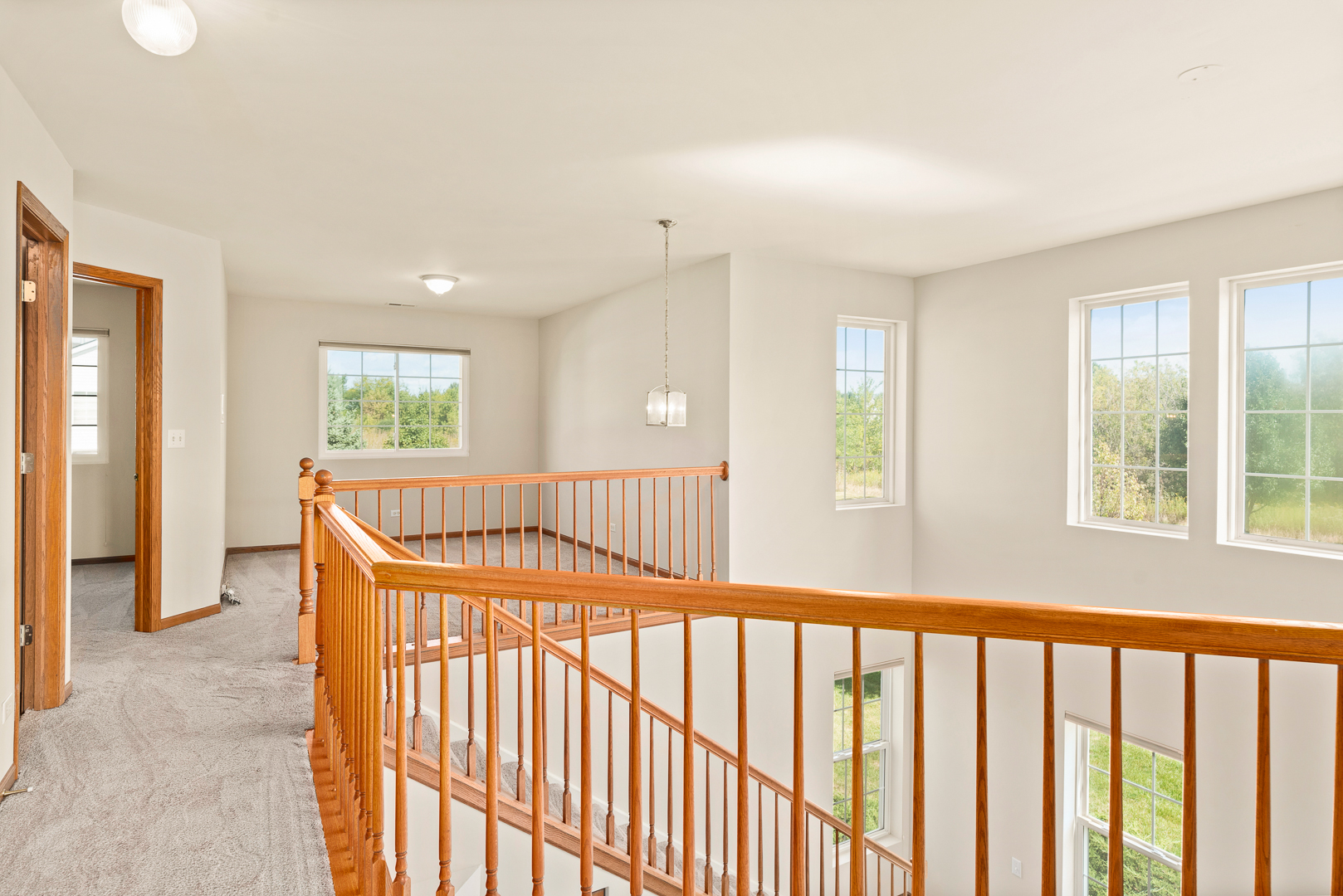 850 County Line Road, Unit 850 Aurora, IL 60502 - Photo 10 of 20 a view of porch with wooden floor and windows