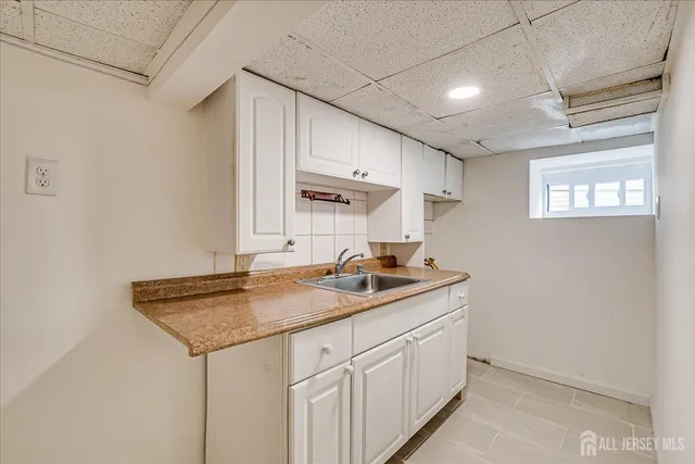 a kitchen with stainless steel appliances granite countertop a sink a stove and a microwave