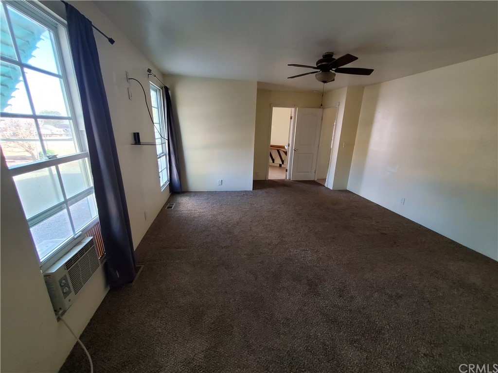 1685 Murrieta Road Perris, CA 92571 - Photo 11 of 19 wooden floor in an empty room with a window