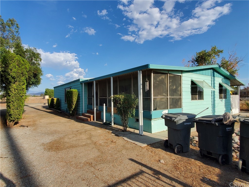 1685 Murrieta Road Perris, CA 92571 - Photo 2 of 19 a view of a house with backyard and porch