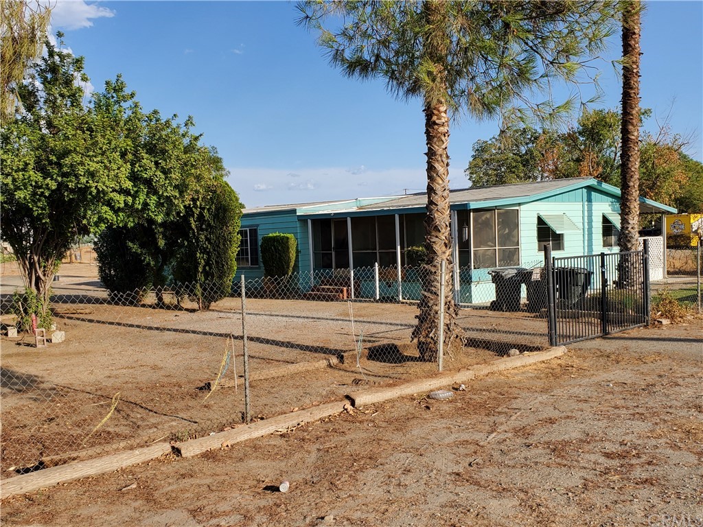1685 Murrieta Road Perris, CA 92571 - Photo 3 of 19 a house with trees in the background