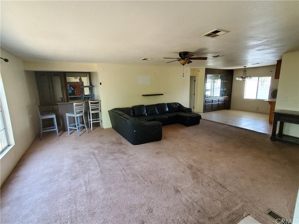 1685 Murrieta Road Perris, CA 92571 - Photo 5 of 19 a living room with furniture and a flat screen tv