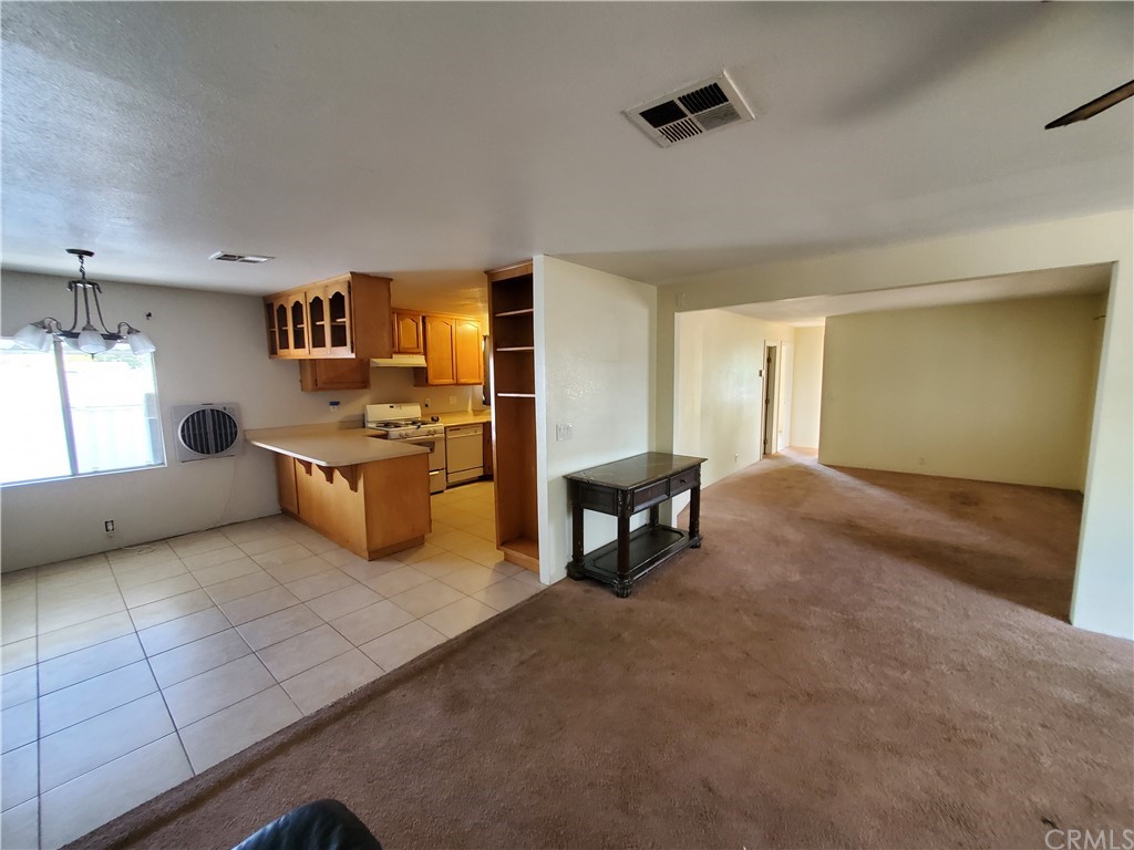 1685 Murrieta Road Perris, CA 92571 - Photo 8 of 19 a view of a livingroom with furniture and a window