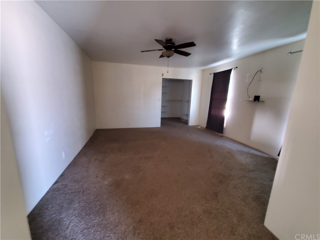 1685 Murrieta Road Perris, CA 92571 - Photo 10 of 19 an empty room with closet and windows