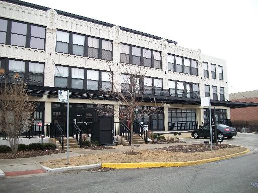1151 West 15th Street, Unit 307 Chicago, IL 60608 - Photo 1 of 1 a view of a building with a outdoor space