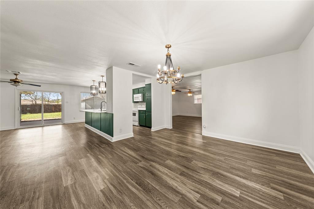 104 East Santa Anna Street Robinson, TX 76706 - Photo 13 of 36 a view of a livingroom with wooden floor