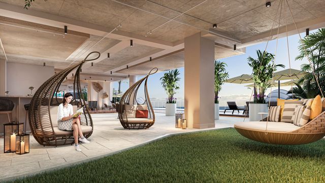 a view of a livingroom with furniture and floor to ceiling window