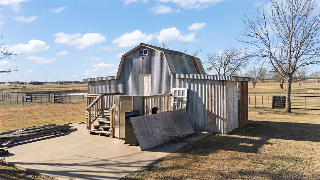 500 County Road 1105 Rio Vista, TX 76093 - Photo 20 of 23 a view of a house with roof deck