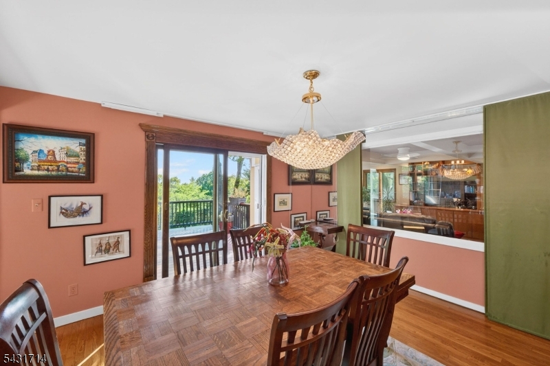 1530 Mountain Top Road Bridgewater, NJ 08807 - Photo 14 of 50 a view of a dining room with furniture a chandelier and wooden floor