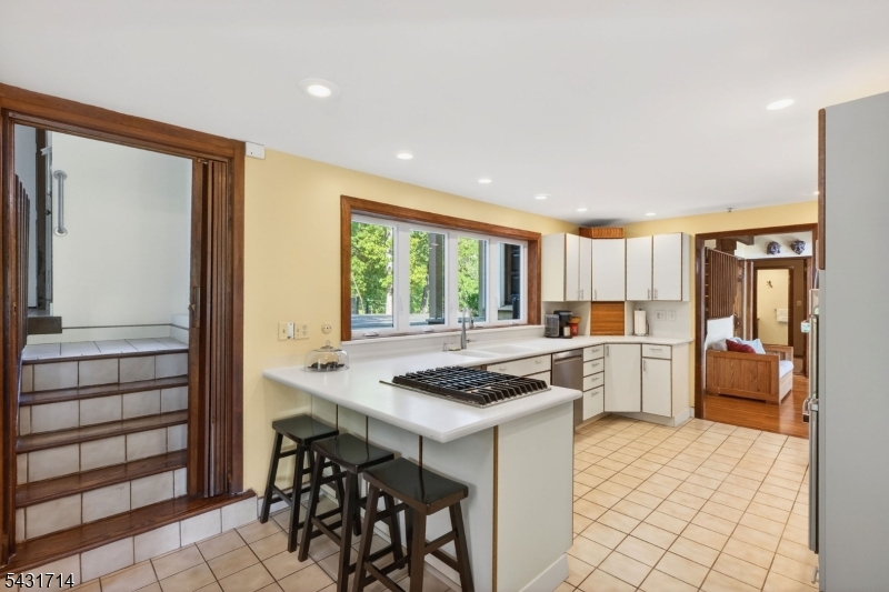 1530 Mountain Top Road Bridgewater, NJ 08807 - Photo 22 of 50 a kitchen that has a stove a table and chairs in it