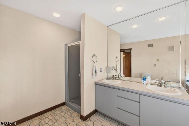1530 Mountain Top Road Bridgewater, NJ 08807 - Photo 27 of 50 a bathroom with a double vanity sink mirror and double