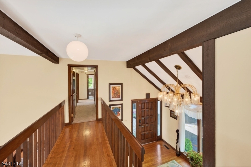 1530 Mountain Top Road Bridgewater, NJ 08807 - Photo 28 of 50 a view of a hallway with wooden floor and staircase