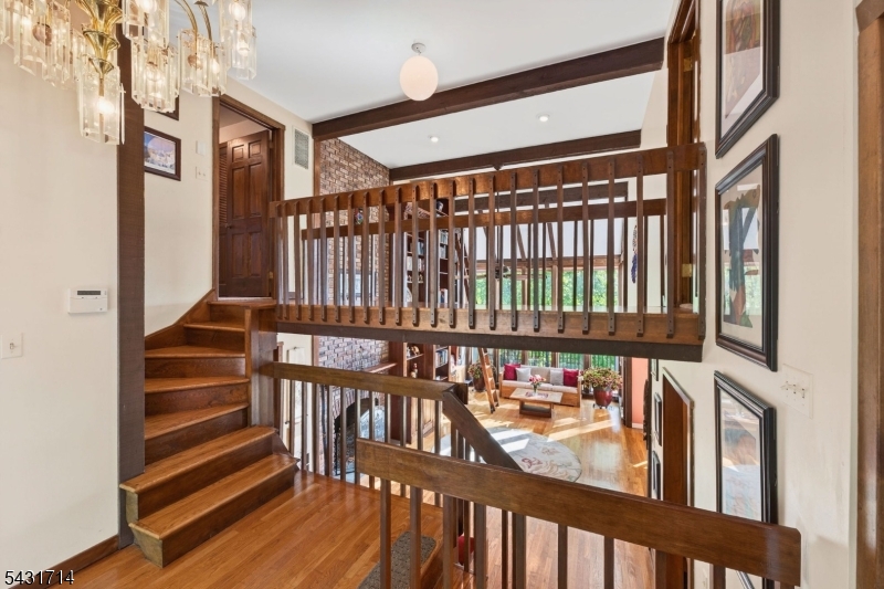 1530 Mountain Top Road Bridgewater, NJ 08807 - Photo 5 of 50 a view of staircase with lots of frames on wall and a window