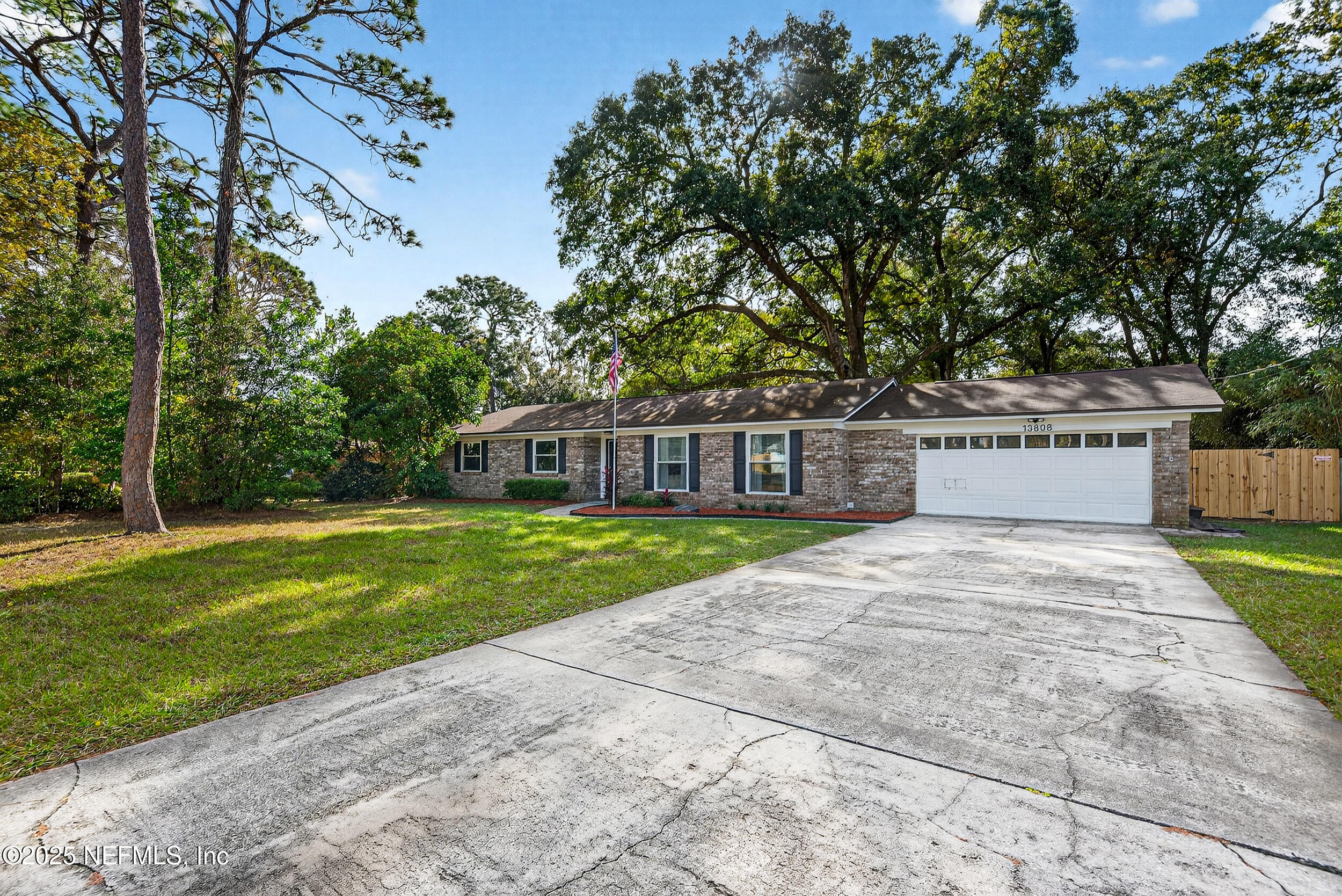 13808 Spanish Point Drive Jacksonville, FL 32225 - Photo 2 of 25 a front view of a house with a yard