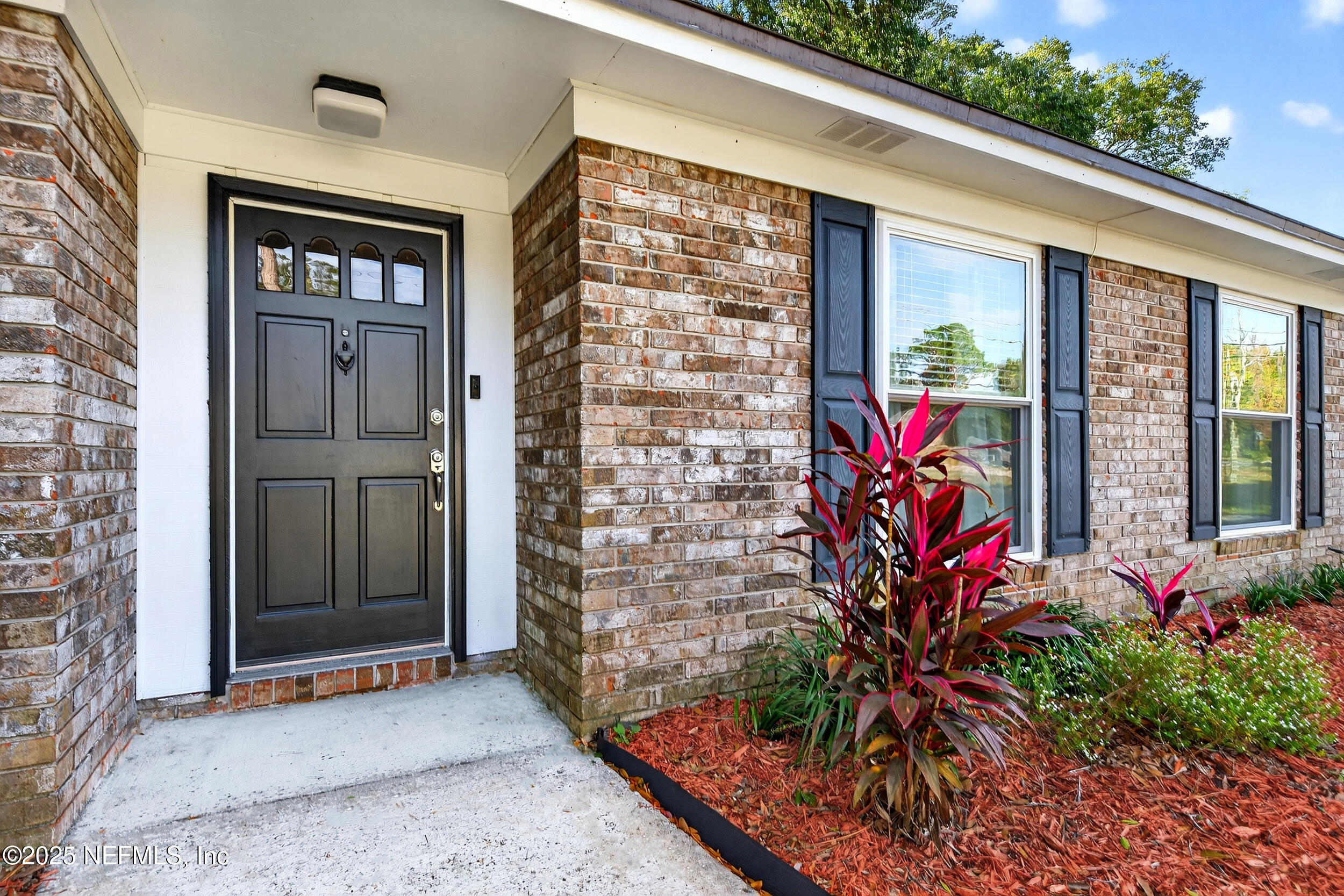 13808 Spanish Point Drive Jacksonville, FL 32225 - Photo 3 of 25 a front view of a house with a porch