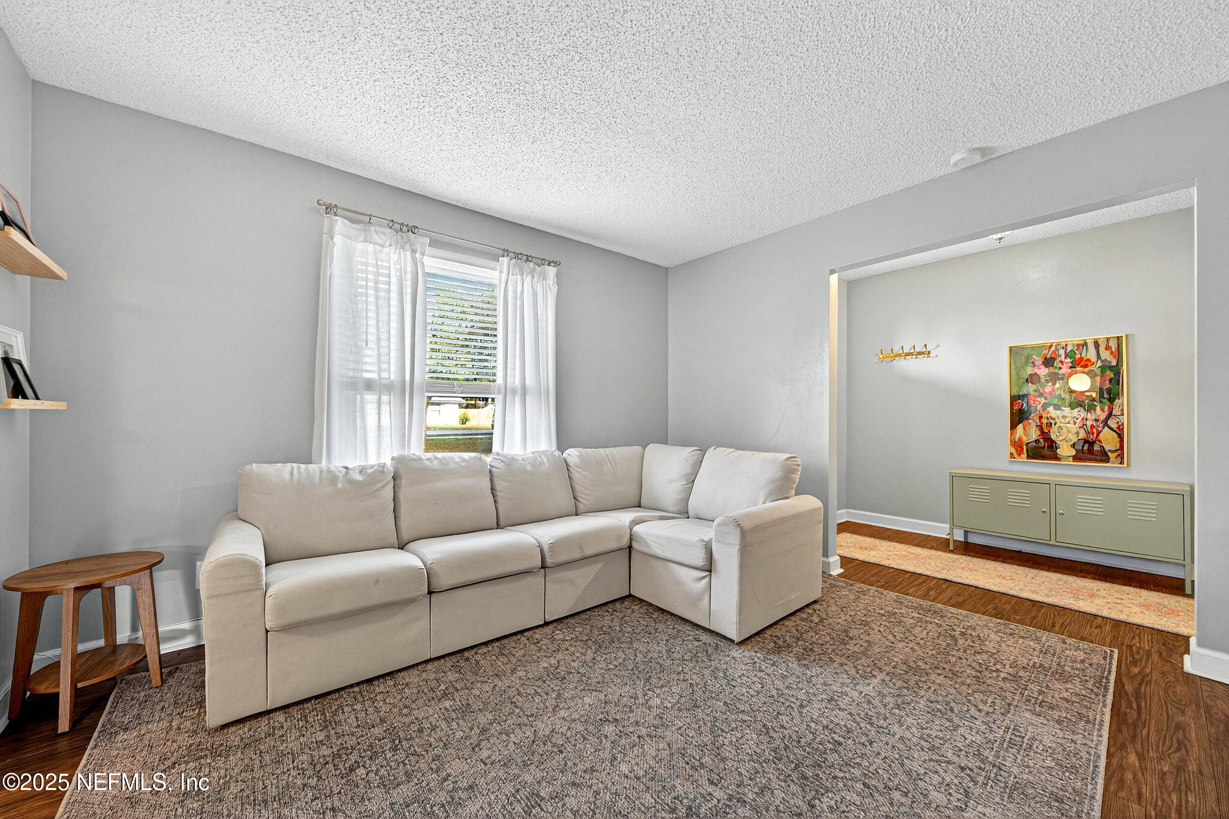 13808 Spanish Point Drive Jacksonville, FL 32225 - Photo 7 of 25 a living room with furniture and a window