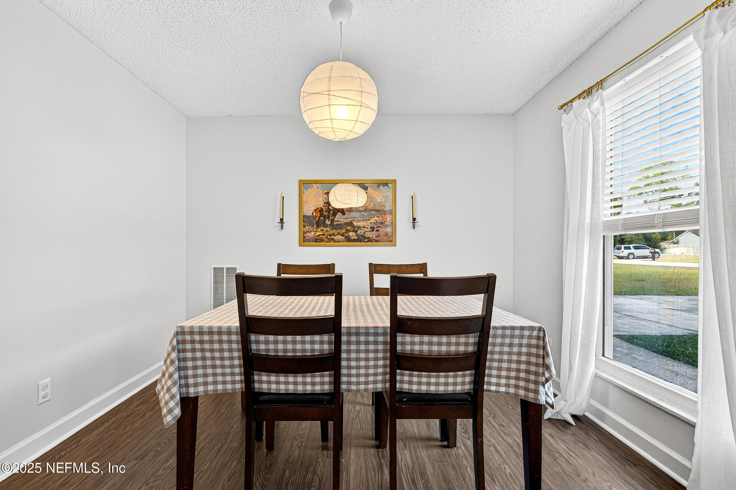 13808 Spanish Point Drive Jacksonville, FL 32225 - Photo 8 of 25 a view of a dining room with furniture and wooden floor