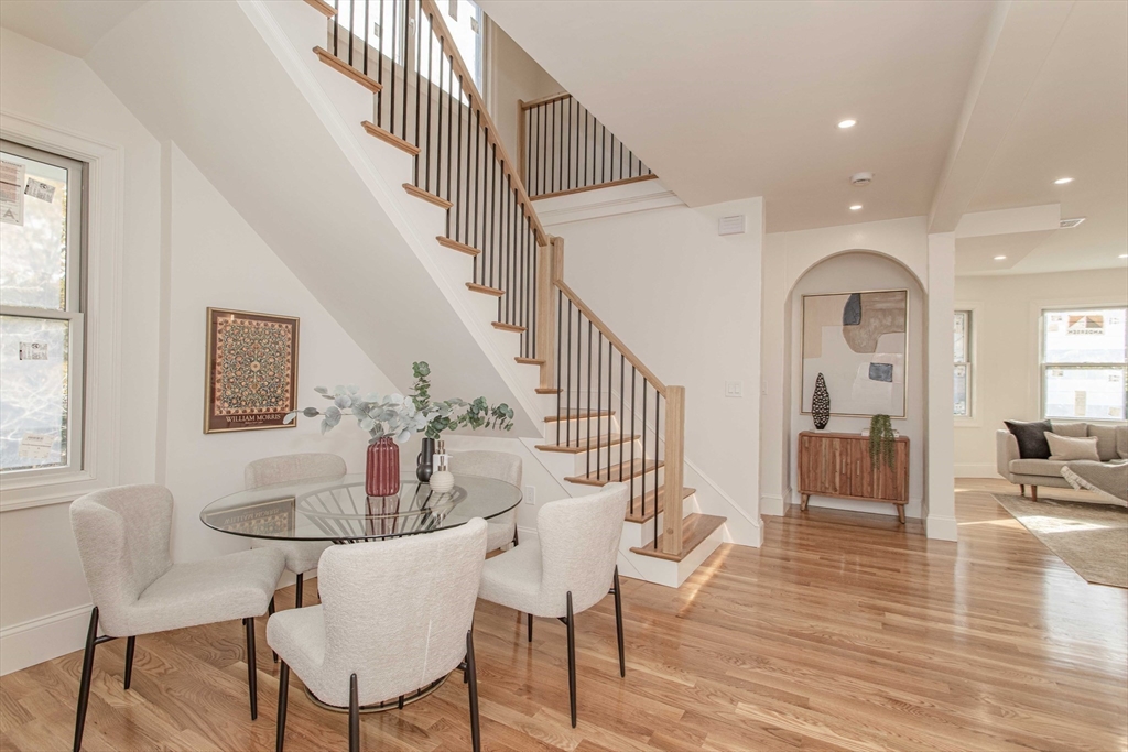 125 Mt Vernon Street, Unit 2 Newton, MA 02465 - Photo 26 of 36 a view of a livingroom with furniture wooden floor and a front door