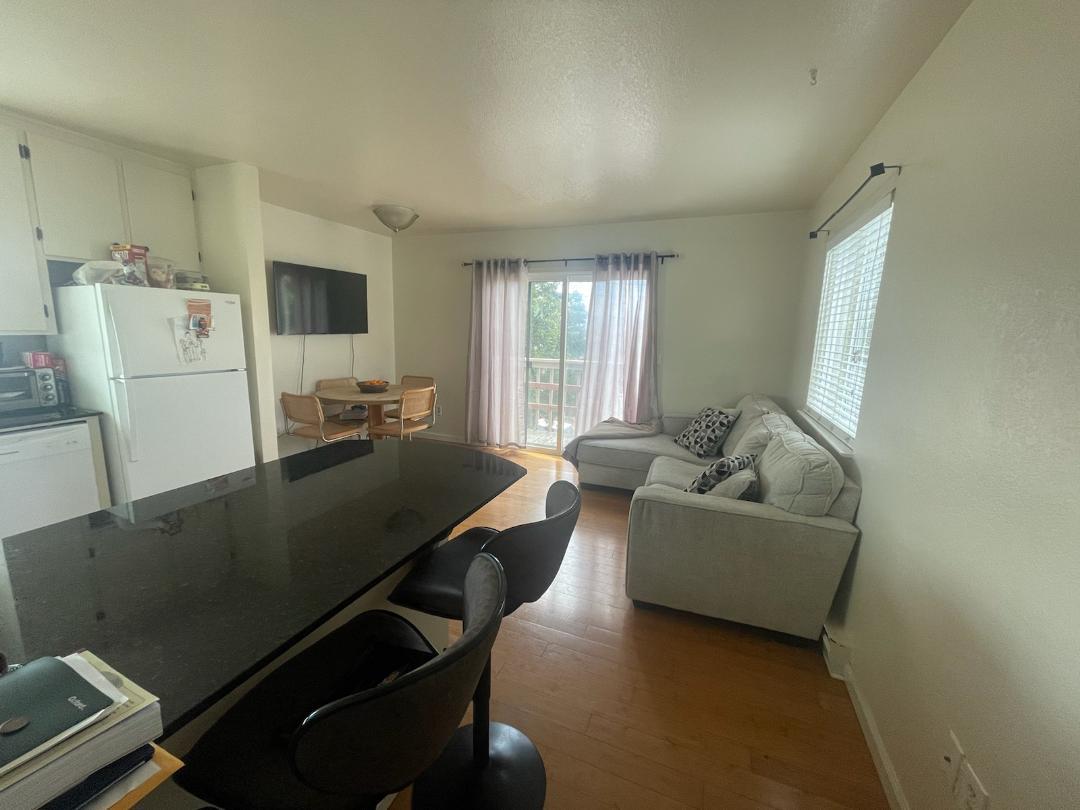 1702 Goodwin Street Seaside, CA 93955 - Photo 5 of 6 a living room with furniture and a window
