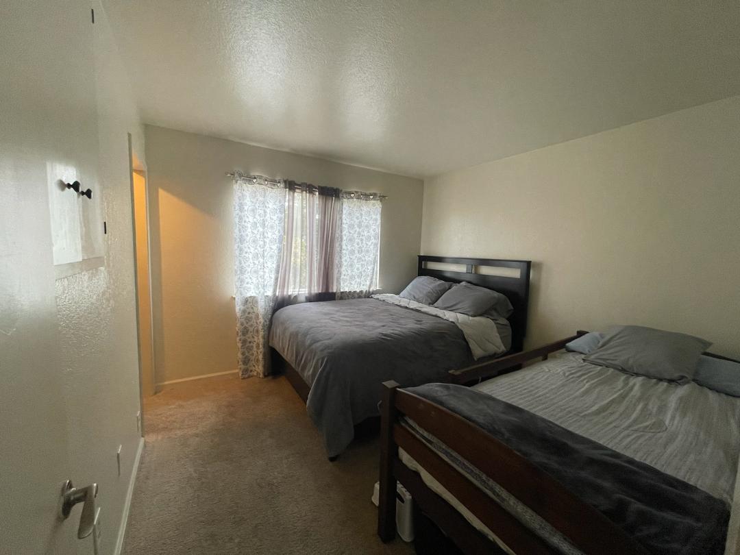 1702 Goodwin Street Seaside, CA 93955 - Photo 6 of 6 a bedroom with two beds and a dresser