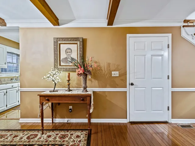 a room with wooden floor and cabinets