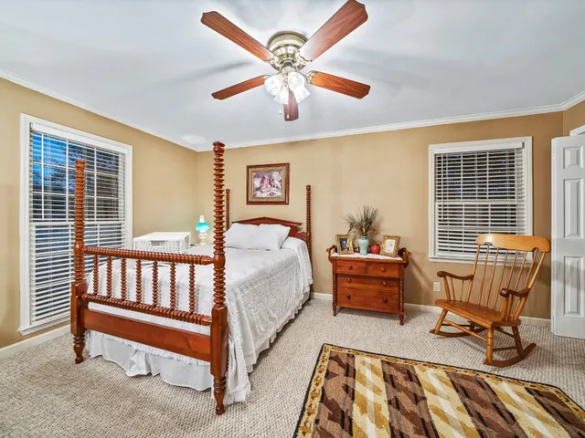 a bedroom with furniture and a window