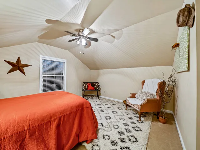 a bedroom with a bed and dresser