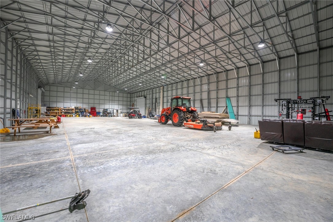 1422 Gate Road LaBelle, FL 33935 - Photo 6 of 16 a car parked in front of a building