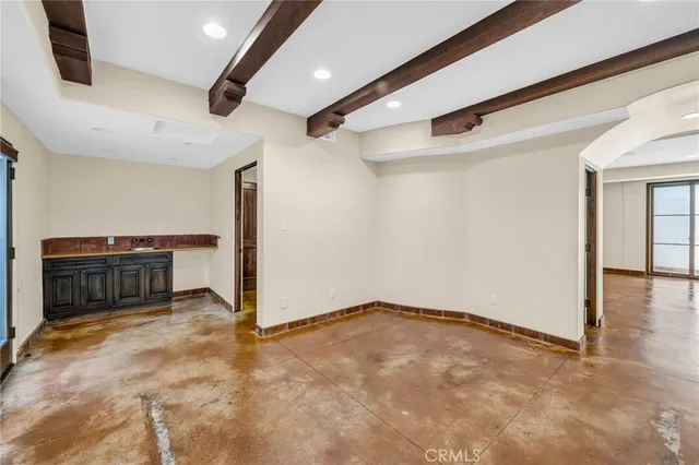 a view of an empty room and wooden floor