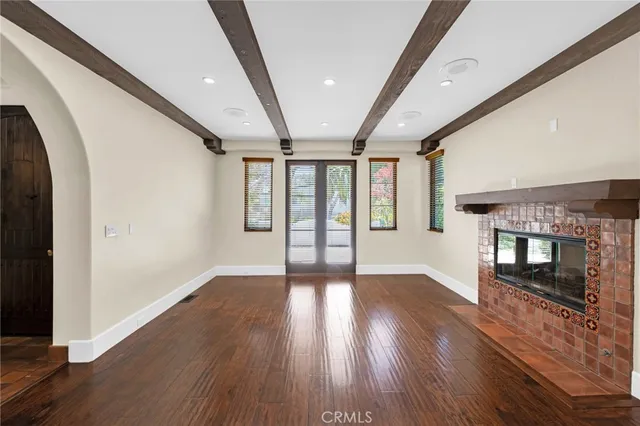a view of an entryway with wooden floor
