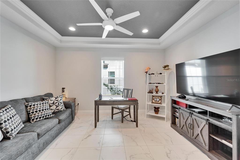 9152 Warm Spgs Circle Parrish, FL 34219 - Photo 12 of 38 a living room with furniture and a flat screen tv