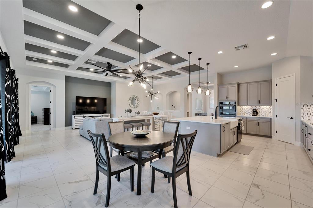 9152 Warm Spgs Circle Parrish, FL 34219 - Photo 13 of 38 a large kitchen with a table and chairs