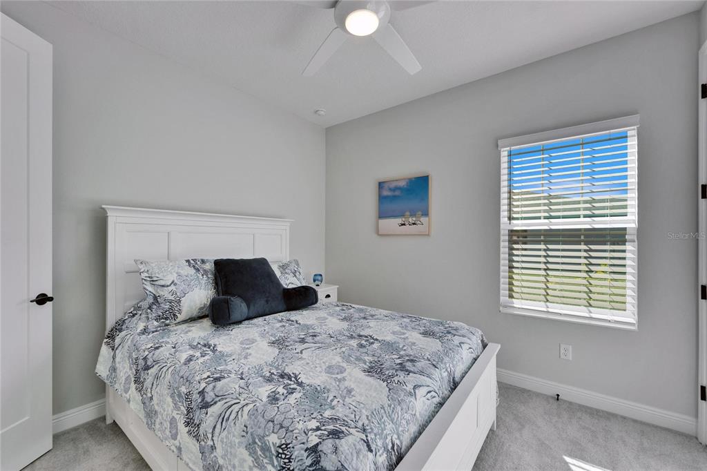 9152 Warm Spgs Circle Parrish, FL 34219 - Photo 14 of 38 a bedroom with a large bed and a window