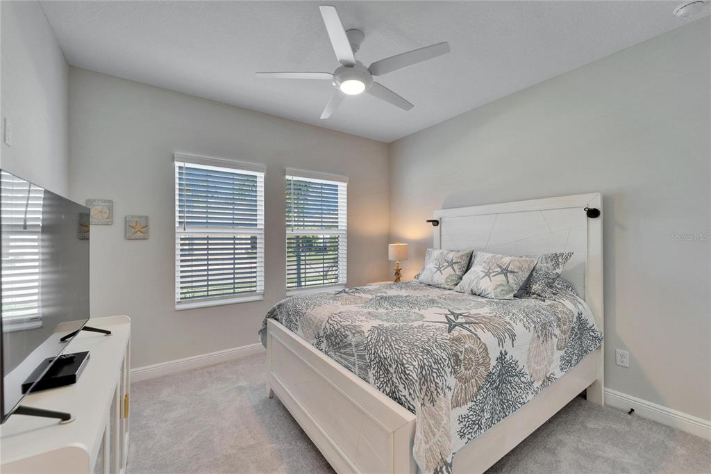 9152 Warm Spgs Circle Parrish, FL 34219 - Photo 16 of 38 a bedroom with a large bed and a window