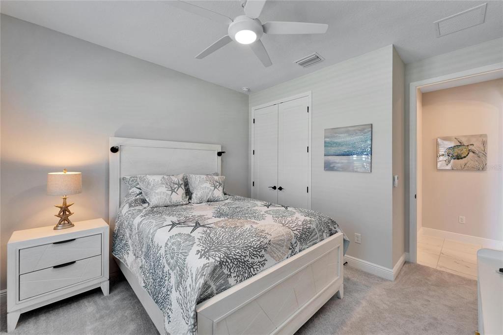 9152 Warm Spgs Circle Parrish, FL 34219 - Photo 17 of 38 a room with a bed and ceiling fan