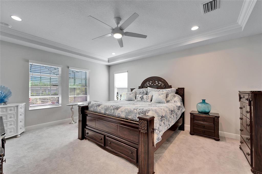 9152 Warm Spgs Circle Parrish, FL 34219 - Photo 20 of 38 a bedroom with a bed and a window