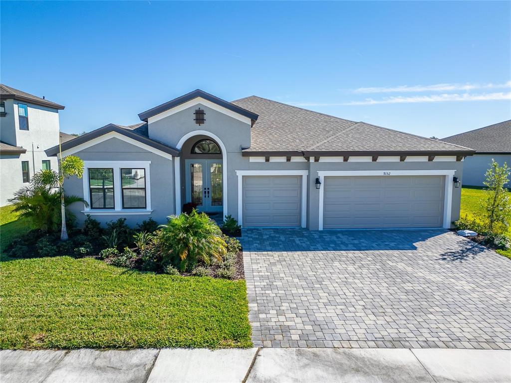 9152 Warm Spgs Circle Parrish, FL 34219 - Photo 2 of 38 a front view of a house with garden