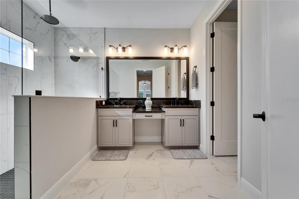 9152 Warm Spgs Circle Parrish, FL 34219 - Photo 23 of 38 a bathroom with a sink and a mirror