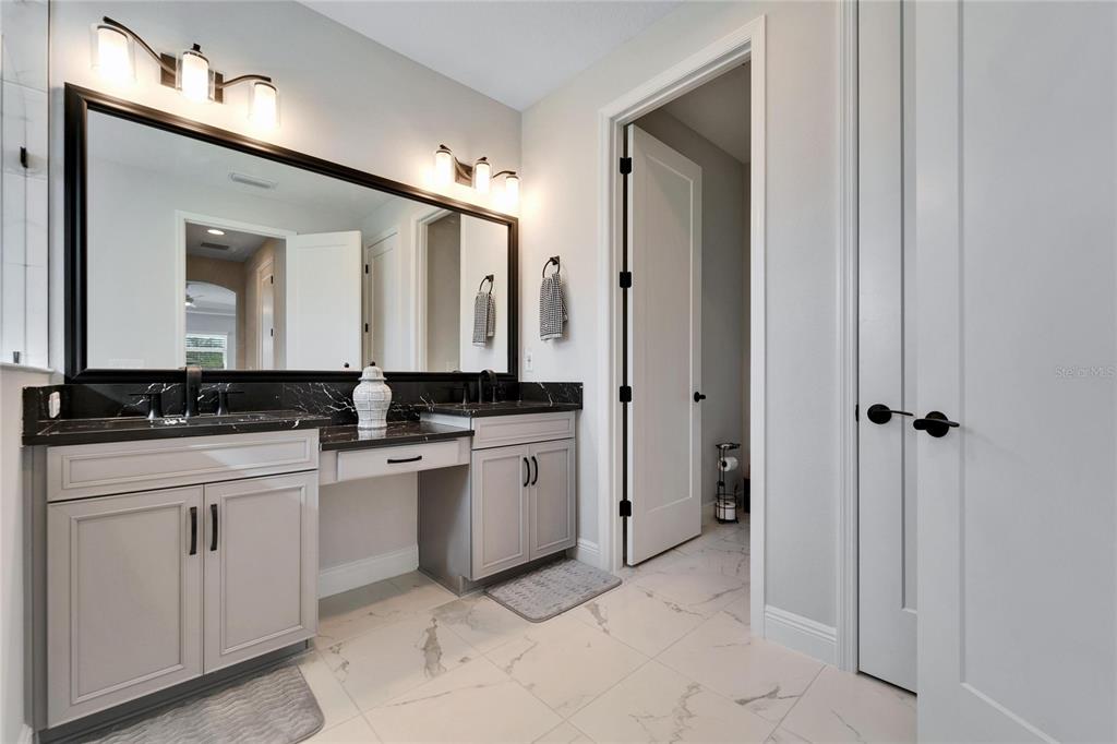 9152 Warm Spgs Circle Parrish, FL 34219 - Photo 24 of 38 a bathroom with a sink and a mirror
