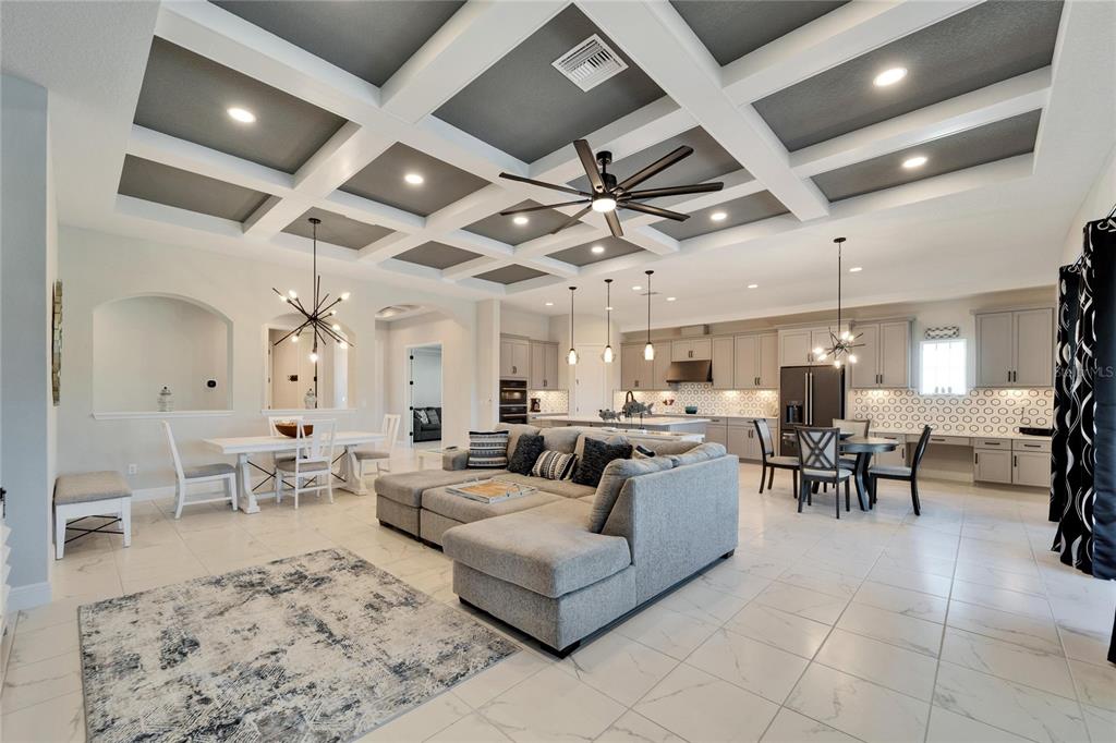9152 Warm Spgs Circle Parrish, FL 34219 - Photo 7 of 38 a living room with lots of furniture and view of kitchen