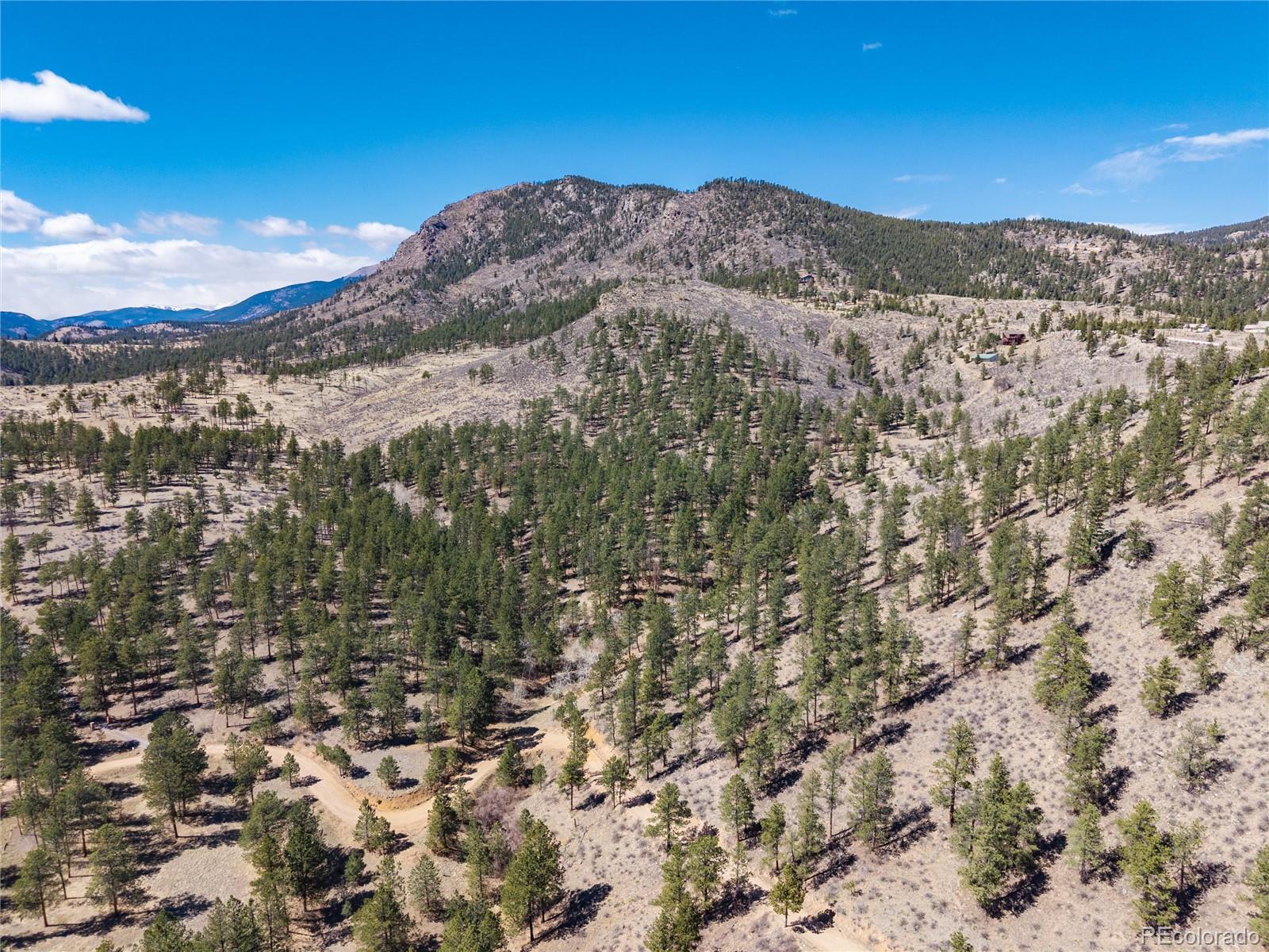 12 A Bailey Estates Bailey, CO 80421 - Photo 12 of 36 a view of a large mountain with mountains in the background