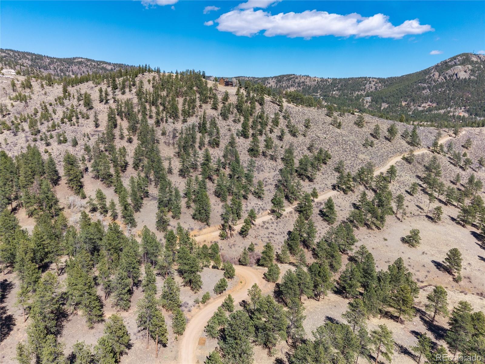 12 A Bailey Estates Bailey, CO 80421 - Photo 13 of 36 a view of a city with mountains in the background